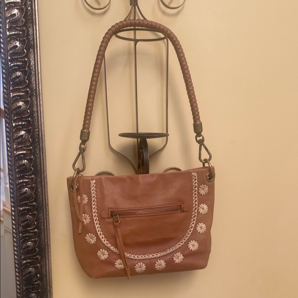 The sak boho leather flower embroidered single braided strap shoulder bag